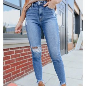 Distressed medium wash skinny jeans